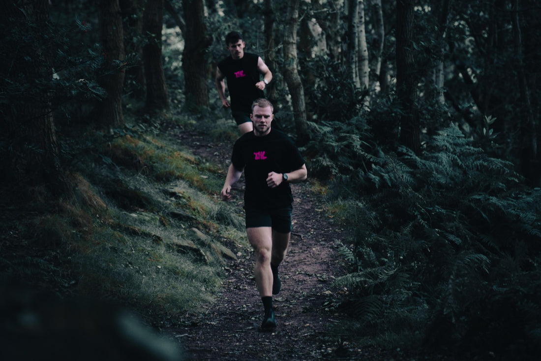 Hybrid Athlete running through fields